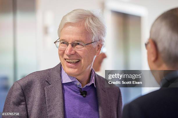 Professor Bengt Holmstrom talks with MIT President L. Rafael Reif before a press conference at MIT announcing his shared Nobel Prize in Economics...