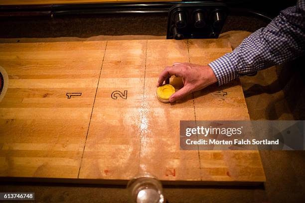 playing shuffleboard - calcium scoring stock pictures, royalty-free photos & images