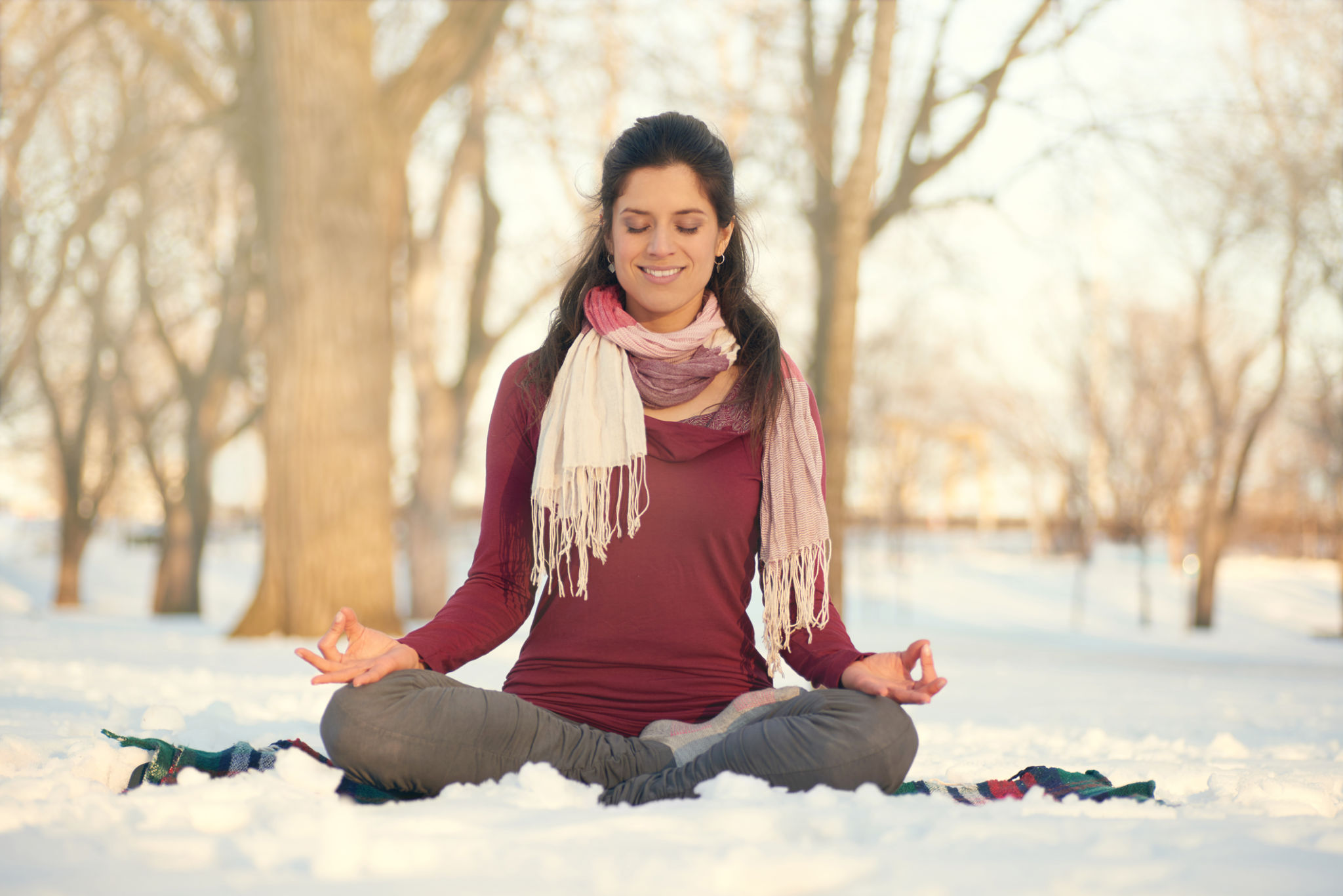 Attractive mixed race woman doing yoga in nature at winter Attractive mixed race woman doing yoga in nature at winter