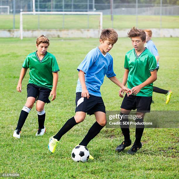 intense soccer players during game - latina legs stockfoto's en -beelden