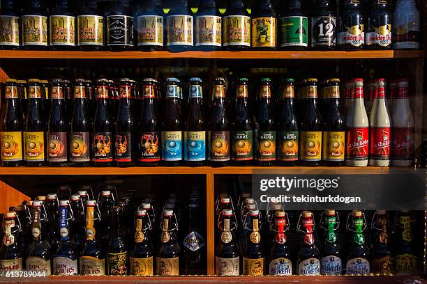 different variety of belgian beers  on store at ghent belgium - ghent belgium stock pictures, royalty-free photos & images