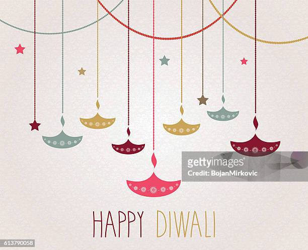 diwali. hanging colorful diya. handwritten text - diwali greetings stock illustrations