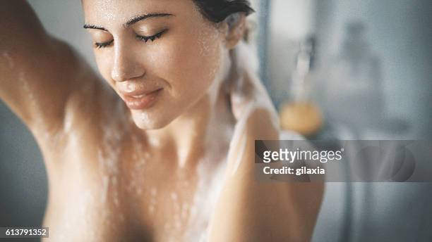 pleasure of a shower. - women taking showers stock pictures, royalty-free photos & images