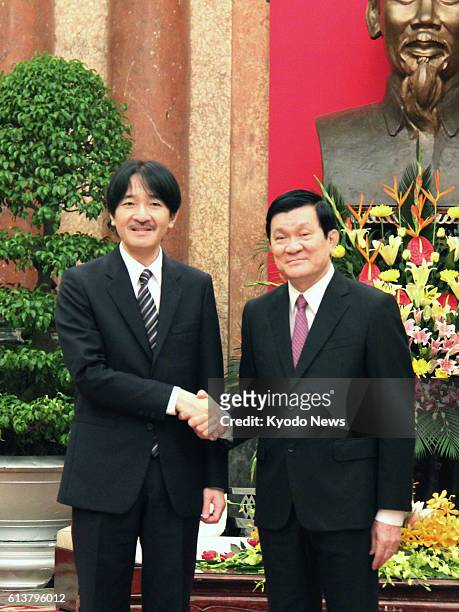 Vietnam - Japan's Prince Akishino shakes hands with Vietnamese President Truong Tan Sang at the presidential office in Hanoi on Aug. 17, 2012. The...