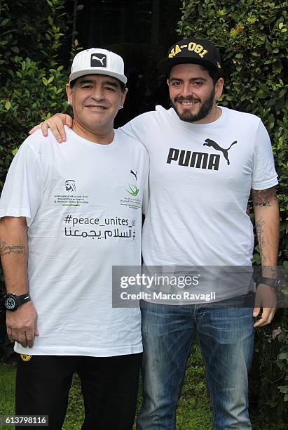 Argentinian soccer legend Diego Armando Maradona with his son Diego Armando Maradona Junior poses during the photocall for the presentation of the...