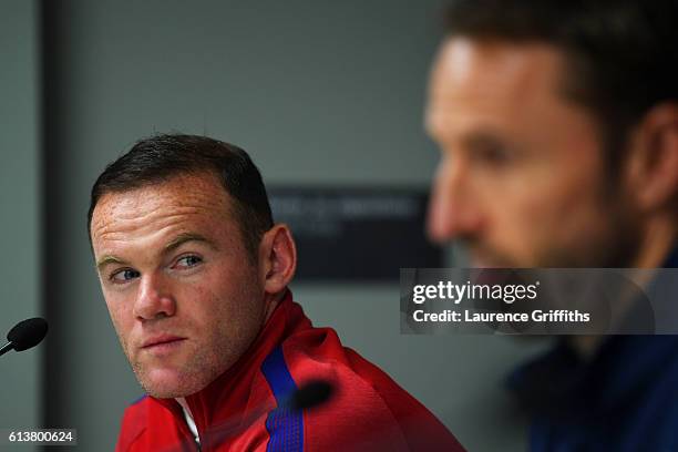 Wayne Rooney of England looks at Interim Manager Gareth Southgate during an England press conference ahead of the FIFA 2018 World Cup Qualifier Group...