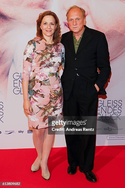 Martina Gedeck and Ulrich Tukur attend the NRW premiere of the film 'Gleissendes Glueck' at Lichtburg on October 10, 2016 in Essen, Germany.