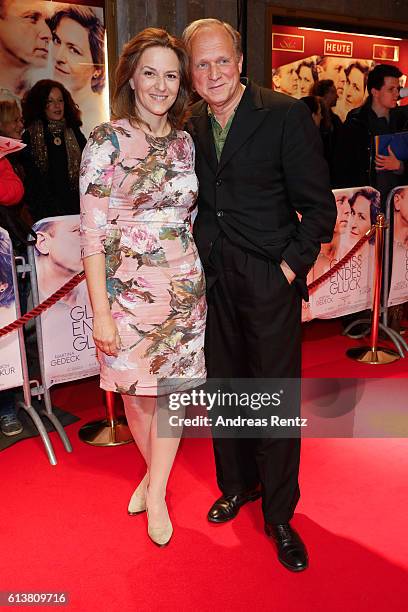 Martina Gedeck and Ulrich Tukur attend the NRW premiere of the film 'Gleissendes Glueck' at Lichtburg on October 10, 2016 in Essen, Germany.