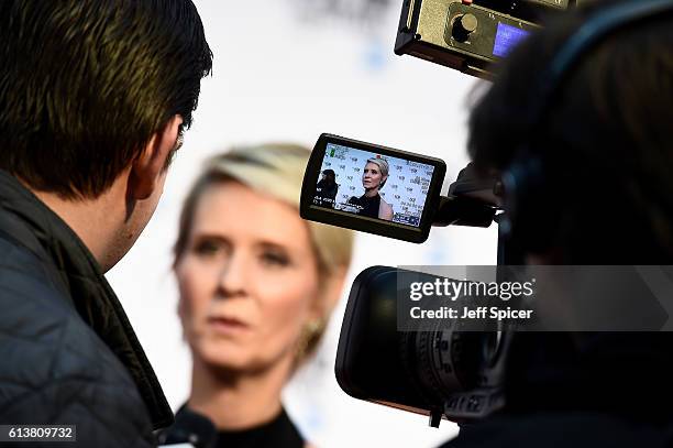 Actress Cynthia Nixon talks to a reporter as she attends the 'A Quiet Passion' official competition screening during the 60th BFI London Film...