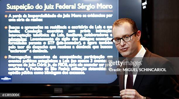 Cristiano Zanin Martins , lawyer of Brazil's former President Luiz Inacio Lula da Silva and his wife Marisa Leticia, talks to the journalists during...