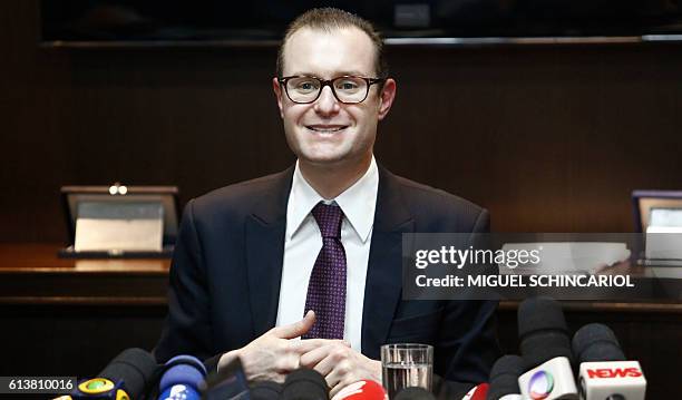 Cristiano Zanin Martins , lawyer of Brazil's former President Luiz Inacio Lula da Silva and his wife Marisa Leticia, talks to the journalists during...