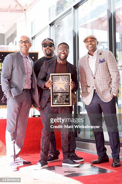Director Tim Story, rapper/actor Ice Cube, actor/comedian Kevin Hart, and producer Will Packer pose for a photo as Kevin Hart is honored with a star...