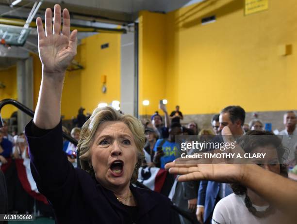 Democratic presidential nominee Hillary Clinton greets attendees at a rally at Wayne State University in Detroit, Michigan October 10, 2016.