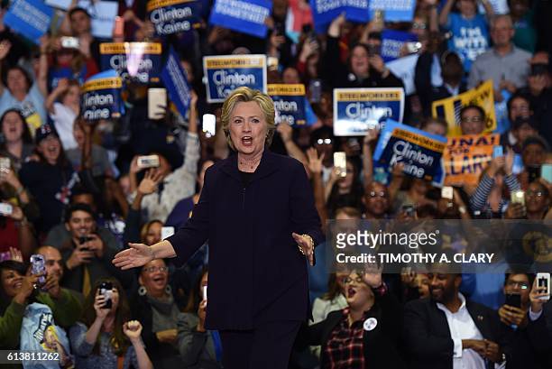 Democratic presidential nominee Hillary Clinton speaks during a rally at Wayne State University in Detroit, Michigan October 10, 2016. / AFP /...