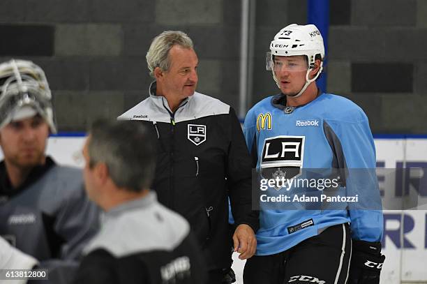 Head Coach Darryl Sutter of the Los Angeles Kings converses with Tyler Toffoli during practice on October 10, 2016 at the Toyota Sports Center in El...