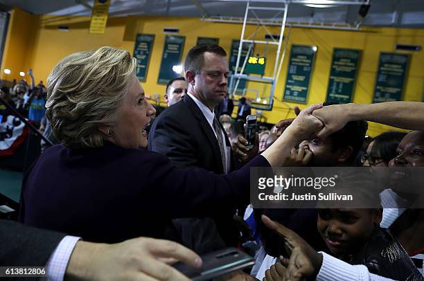 Democratic presidential nominee former Secretary of State Hillary Clinton greets supporters during a campaign rally at Wayne State University on...