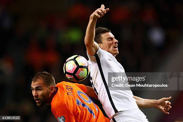 Laurent Koscielny of France and Bas Dost of the Netherlands challenge for the headed ball during the FIFA 2018 World Cup Qualifier between...