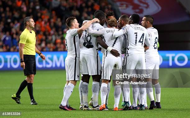 Players of France celebrate after scoring a goal during the FIFA 2018 World Cup Qualifier between The Netherlands and France at Amsterdam Arena on...