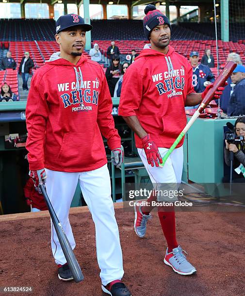 Boston Red Sox players Mookie Betts, left, and Chris Young get ready for batting practice before Game Three of the American League Division series...