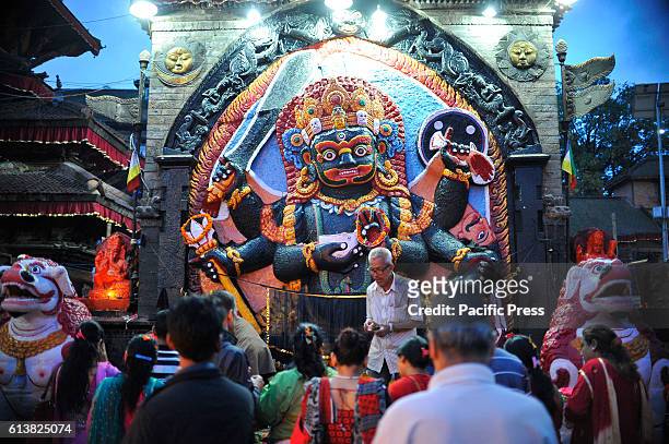 Devotee offering rituals infornt of Kaal Bhairab on the occasion of Navami, ninth day of Dashain Festival at Basantapur Durbar Square. The temple...
