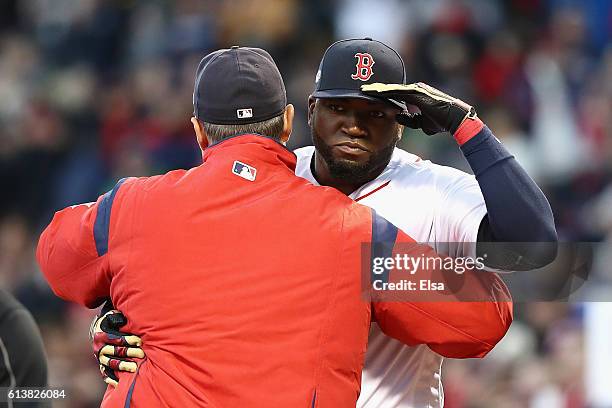 David Ortiz of the Boston Red Sox greets manager John Farrell prior to game three of the American League Divison Series against the Cleveland Indians...