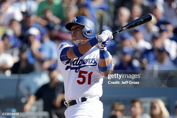 Carlos Ruiz of the Los Angeles Dodgers hits a two-run home run in the in fifth inning in game three of the National League Division Series against...