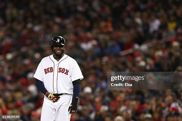 David Ortiz of the Boston Red Sox reacts after being walked in the second inning against the Cleveland Indians during game three of the American...