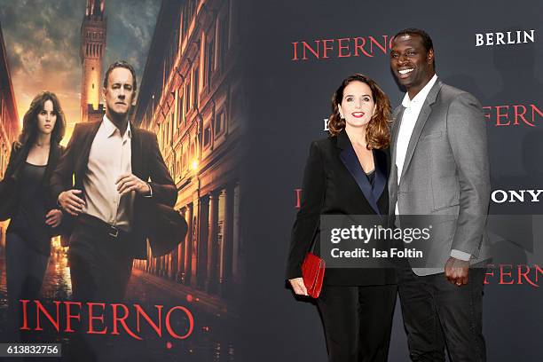 French actor Omar Sy and his wife Helene Sy attend the German premiere of the film 'INFERNO' at Sony Centre on October 10, 2016 in Berlin, Germany.