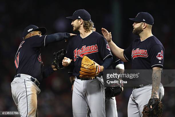 Josh Tomlin of the Cleveland Indians is congratulated by teammates as he is relieved in the sixth inning against the Boston Red Sox during game three...