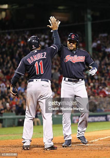 Coco Crisp of the Cleveland Indians celebrates with Jose Ramirez after hitting a two-run home run in the sixth inning against the Boston Red Sox...