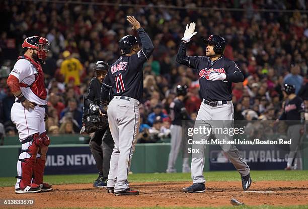 Coco Crisp of the Cleveland Indians celebrates with Jose Ramirez after hitting a two-run home run against the Boston Red Sox in the sixth inning of...