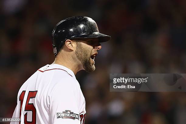 Dustin Pedroia of the Boston Red Sox reacts after striking out in the eighth inning against the Cleveland Indians during game three of the American...