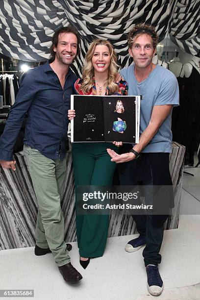 Ned Rocknroll, Sara Blakely and Jesse Itzler pose for a photo together as Sara Blakely and Alice + Olivia celebrate the launch of "The Belly Art...