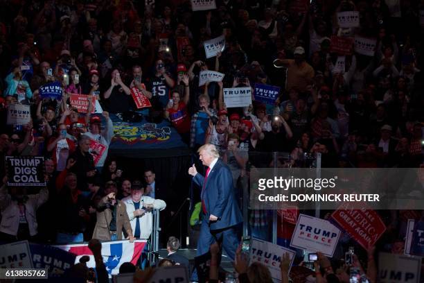 Republican presidential nominee Donald Trump arrives on stage during a rally at Mohegan Sun Arena in Wilkes-Barre, Pennsylvania on October 10, 2016.