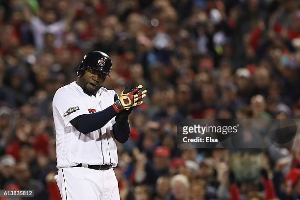 David Ortiz of the Boston Red Sox pumps up the crowd in the eighth inning against the Cleveland Indians during game three of the American League...