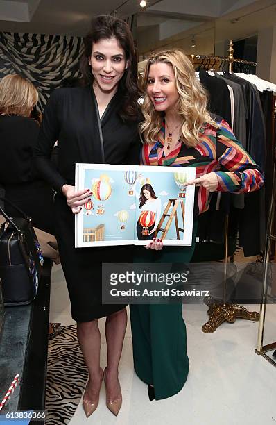 Alida Boer and Sara Blakely pose for a photo together as Sara Blakely and Alice + Olivia celebrate the launch of "The Belly Art Project" on October...