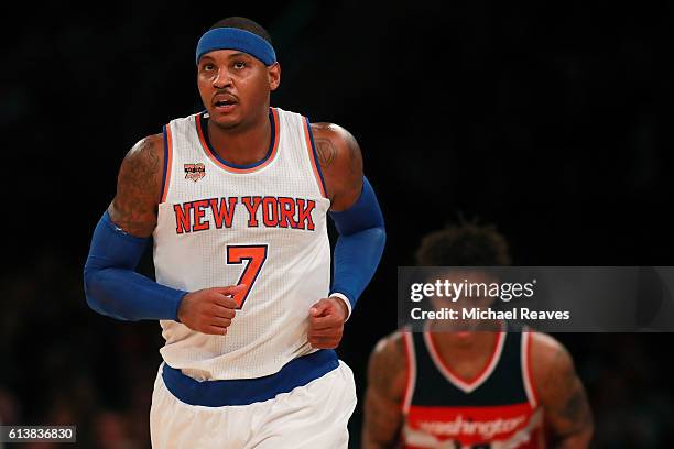 Carmelo Anthony of the New York Knicks runs up the court after hitting a jump shot in the first half of the preseason game at Madison Square Garden...