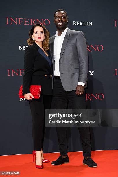 Helene Sy and Omar Sy attend the German premiere of the film 'INFERNO' at Sony Centre on October 10, 2016 in Berlin, Germany.