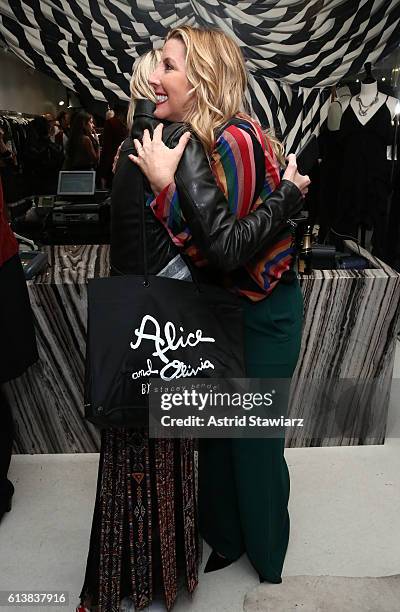 Zanna Roberts Rassi greets Sara Blakely as Blakely and Alice + Olivia celebrate the launch of "The Belly Art Project" on October 10, 2016 in New York...