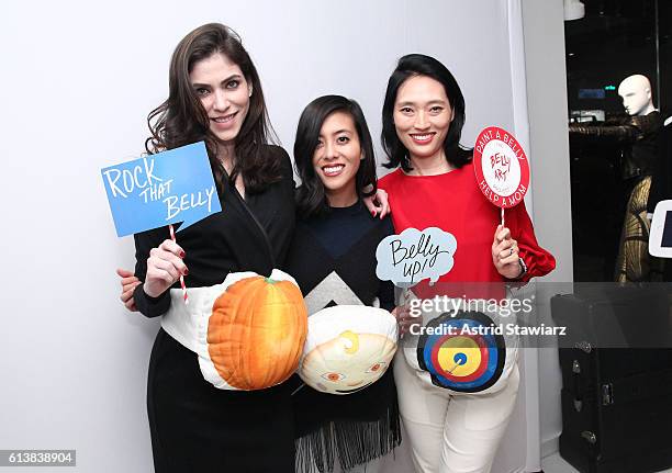 Alida Boer, Ann Wang and Amanda Chu pose for a photo together as Sara Blakely and Alice + Olivia celebrate the launch of "The Belly Art Project" on...
