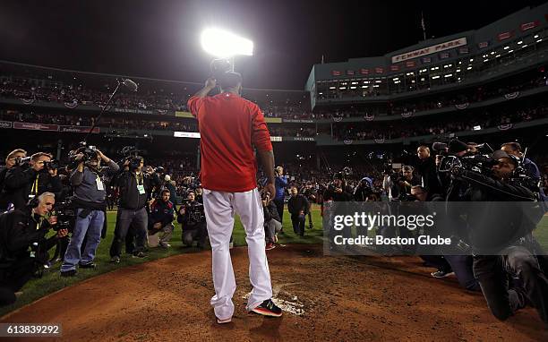 Boston Red Sox designated hitter David Ortiz salutes the fans after the Red Sox lost to the Cleveland Indians. The loss ended the Red Sox season and...