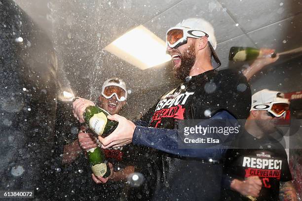 Jason Kipnis of the Cleveland Indians celebrates with teammates in the clubhouse after defeating the Boston Red Sox 4-3 in game three of the American...
