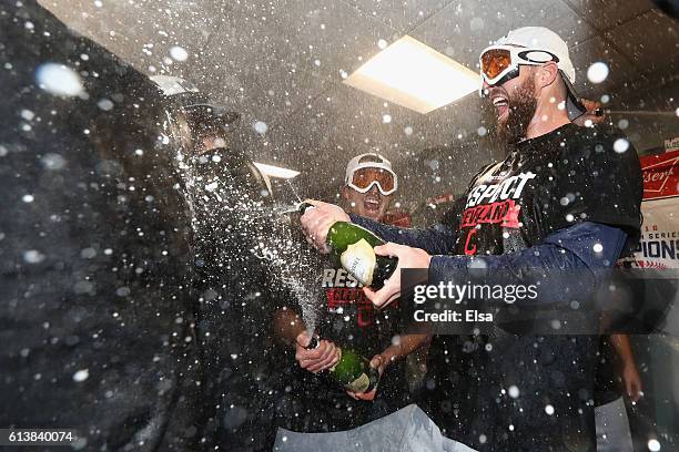 Jason Kipnis of the Cleveland Indians celebrates with teammates in the clubhouse after defeating the Boston Red Sox 4-3 in game three of the American...