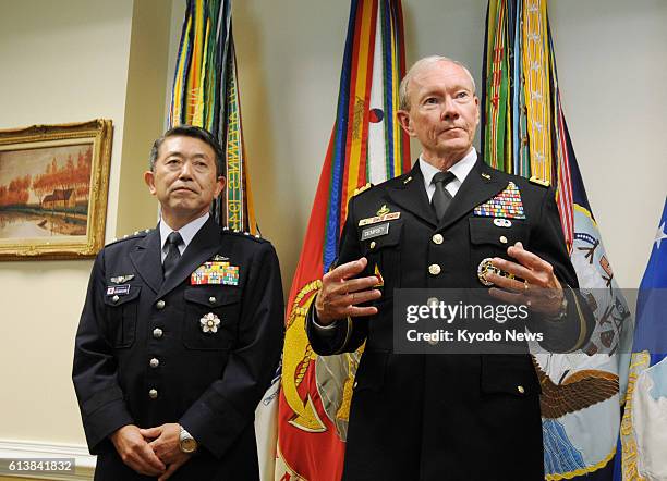 United States - Japanese Self-Defense Forces' Chief of Joint Staff Gen. Shigeru Iwasaki and U.S. Joint Chiefs of Staff Chairman Gen. Martin Dempsey...