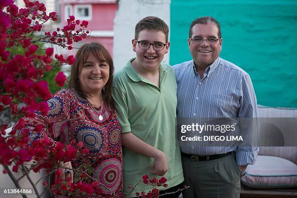 Nicolas Flores poses with his parents, Sandra Violino and Osvaldo Flores at their home in Cordoba, Argentina on September 21, 2016. Nicolas Flores is...