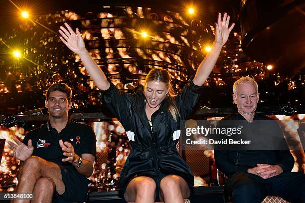 Tennis players Mark Philippoussis, Maria Sharapova and former tennis player John McEnroe attend the live auction at the World TeamTennis Smash Hits...