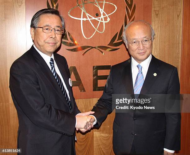 Austria - International Atomic Energy Agency chief Yukiya Amano and Fukushima Gov. Yuhei Sato shake hands at the IAEA headquarters in Vienna,...