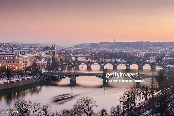 vltava river and old town in winter, prague, czech republic - prague photos et images de collection