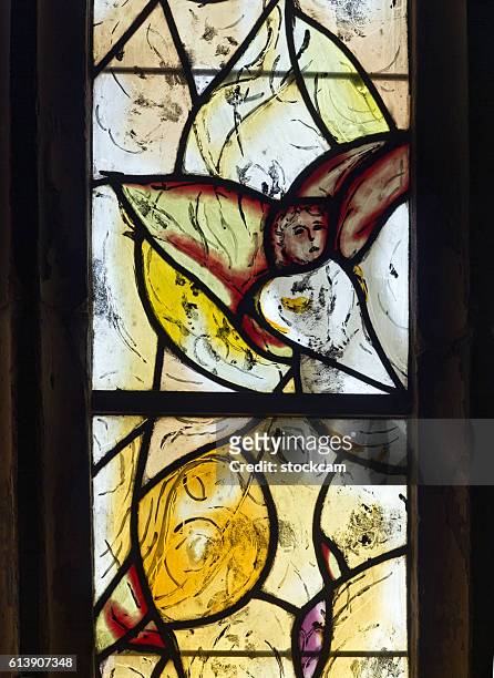 chagall angel window in all saints church, kent, uk - stained glass angel stock pictures, royalty-free photos & images