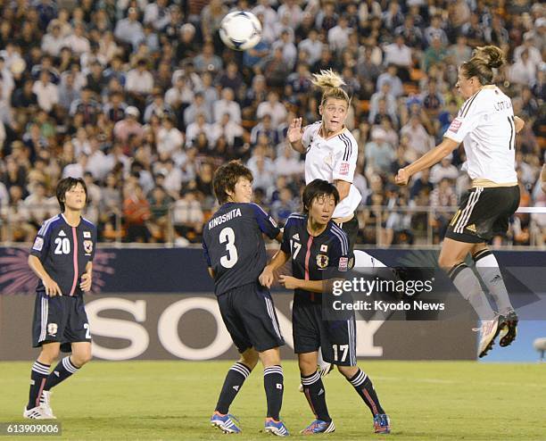 Japan - Lena Lotzen heads home from a corner Germany's third goal during the first half of the Under-20 Women's World Cup soccer tournament...